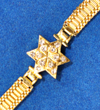 Golden Rakhi Bracelet with Star Shaped Design