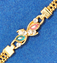 Golden Rakhi Bracelet with Colorful Stones