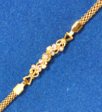 Golden Rakhi with White Stones